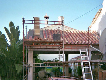 Photo after the structure was completed. Construction of roof with old original tiles