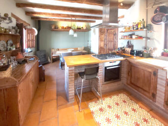 Photo of kitchen Using reclaimed beams, terracotta flooring and bespoke hand made, rustic style kitchen