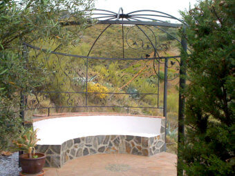 Beton half round terrace seating with ornate steel gazebo